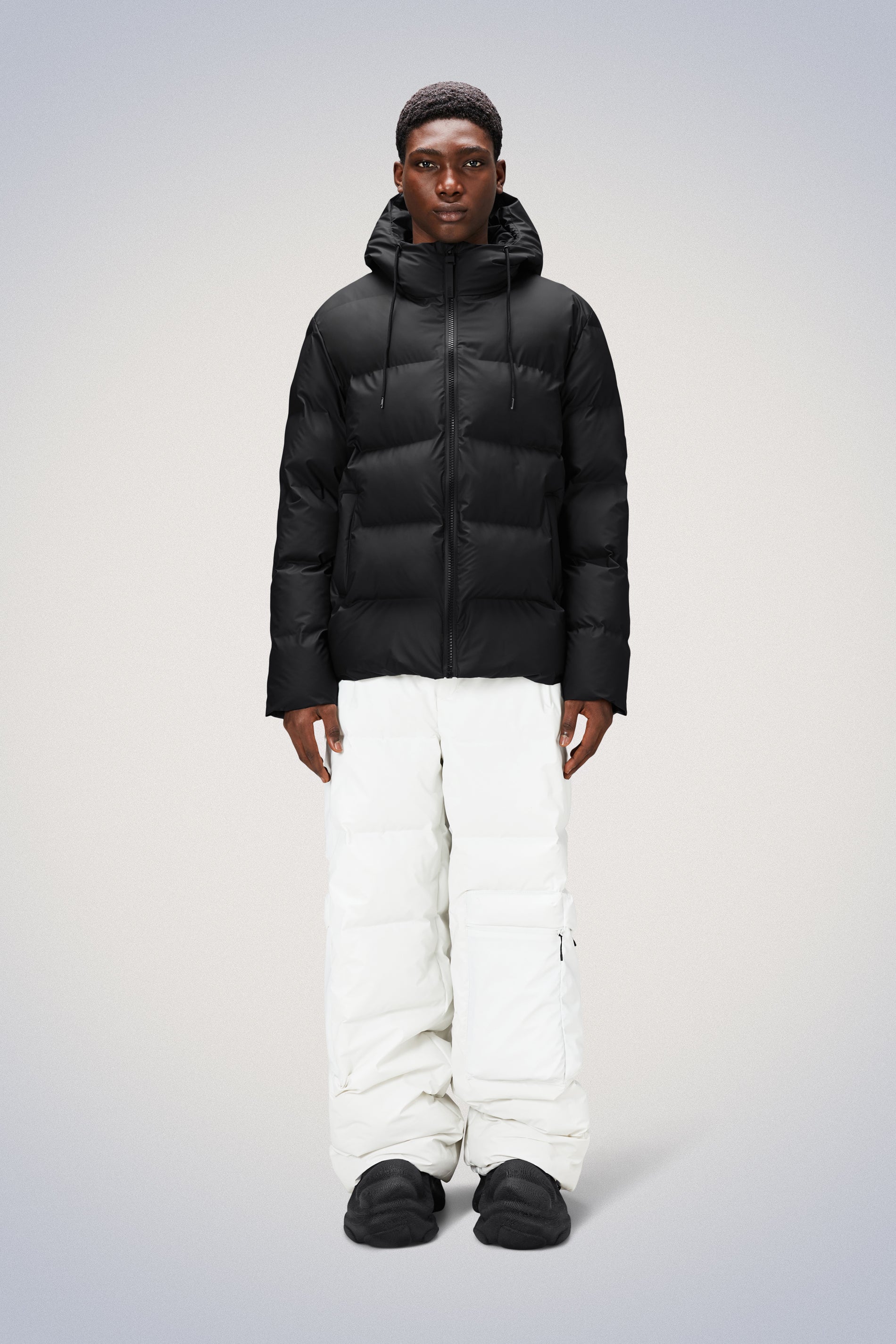 Rains® Long Puffer Jacket in Black for $700